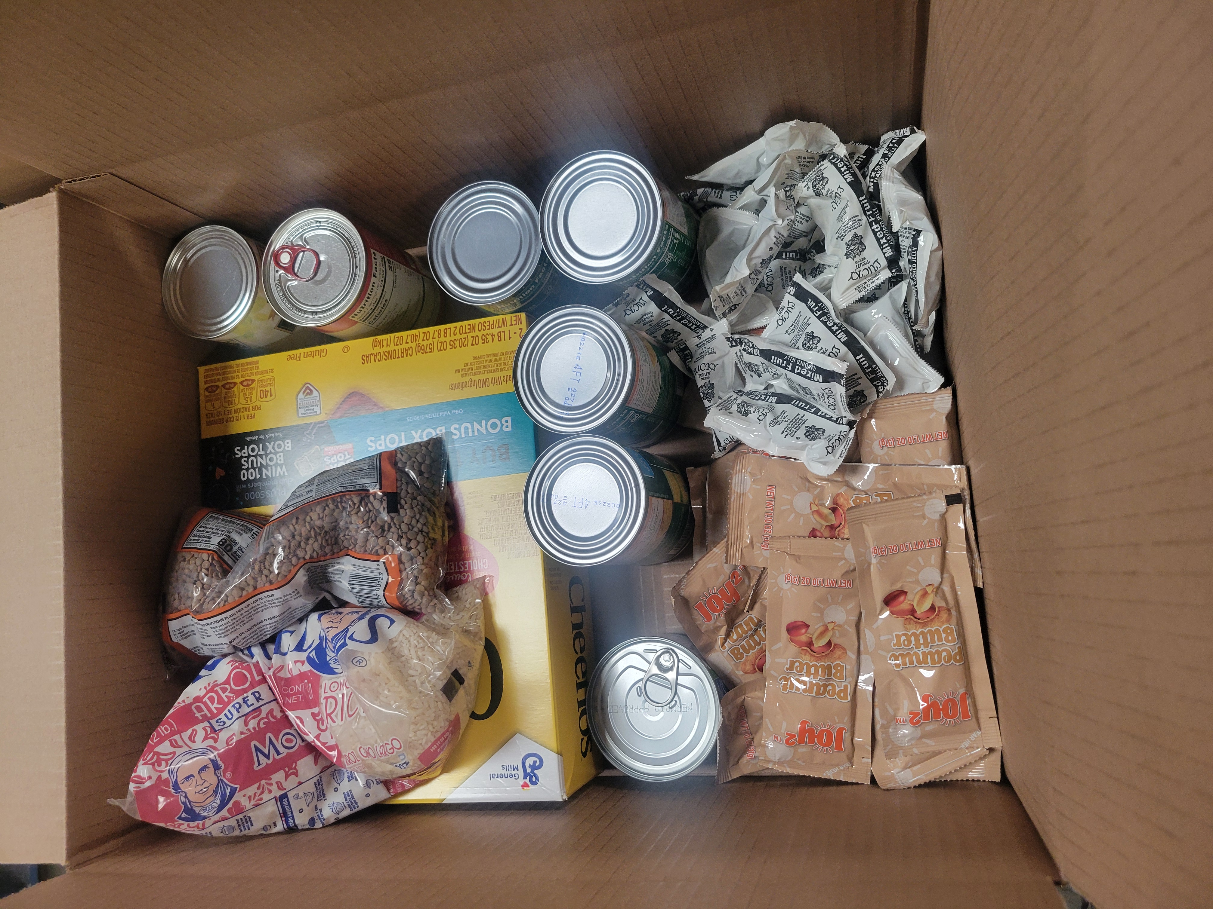 Cardboard box filled with dry goods.